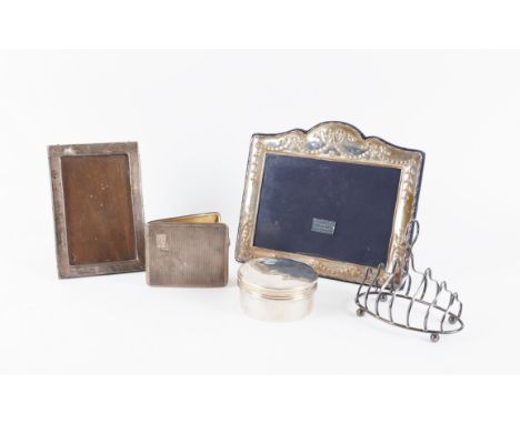 SILVER AND SILVER MOUNTED WARES (5)Comprising; a toast rack, Birmingham 1909, a cigarette case, Birmingham 1937, combined gro