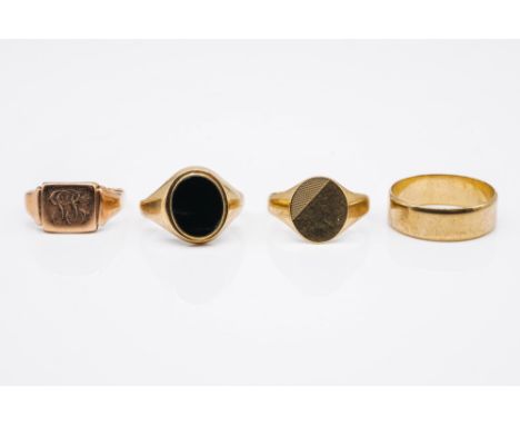 FOUR 9CT GOLD RINGS (4)Comprising a black onyx oval signet ring London 1979 size Q, an oval signet ring with engine turned de