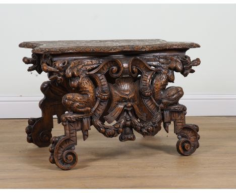 A 19TH CENTURY ITALIAN CARVED WALNUT HALL BENCH WITH GROTESQUE BEAST DECORATION83cm wide; 45cm deep; 54cm high19th century an