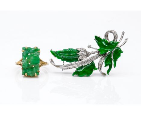 A WHITE GOLD, JADE AND DIAMOND BROOCH AND A JADE RING (2)The brooch designed as a foliate spray, the leaves as carved jades, 