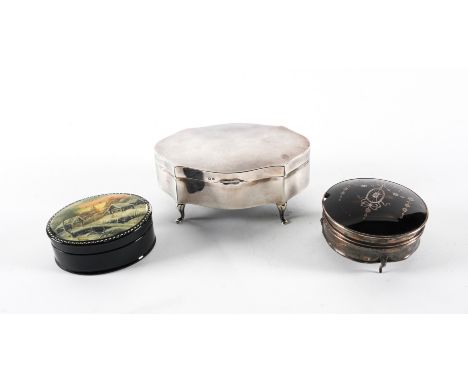 A SILVER HINGE LIDDED TRINKET BOX AND TWO OTHER BOXES (3)The shaped oval trinket box raised on four pad feet, textile lined w