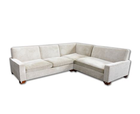 KINGCOME; A LARGE CREAM UPHOLSTERED CORNER SOFA270cm wide; 310cm long; 88cm highGood overall condition, slightly used conditi