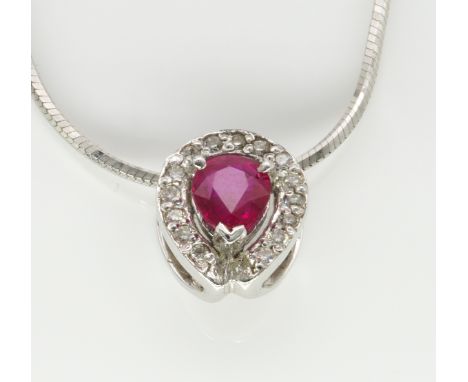 A WHITE GOLD, RUBY AND DIAMOND PENDANT WITH A WHITE GOLD NECKCHAINThe pendant claw set with a pear shaped ruby in a surround 