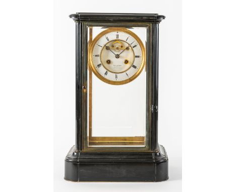 A FRENCH GILT BRASS AND BLACK MARBLE FOUR-GLASS MANTEL CLOCKCirca 1875With bevelled glass panels, the dial with visible escap