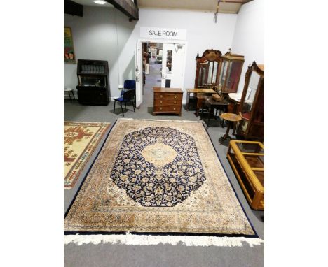 A Tabriz pattern carpet, central medallion on a blue field, border within guards, 350cm x 250cm.