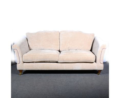 A contemporary sofa, fawn upholstery, square tapering legs, length 214cm.