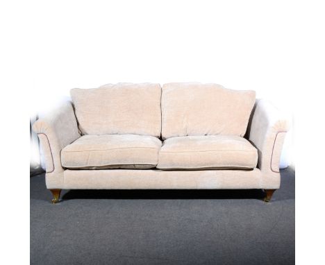 A contemporary sofa, fawn upholstery, square tapering legs, length 214cm.