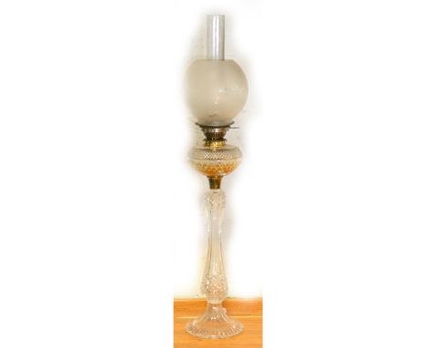 A cut-glass oil lamp, complete with frosted shade and chimney, 91cm.