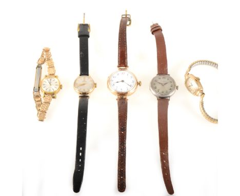 A lady's gold Omega watch, two other gold case watches, Tissot gold-plated, the Omega having a circular cream baton dial with