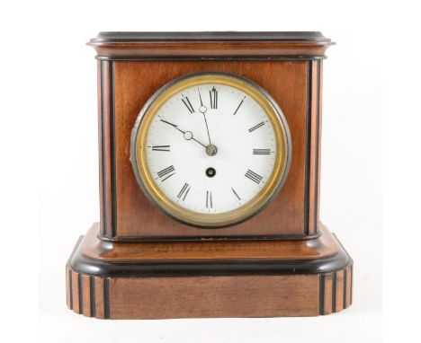 A walnut and ebonised mantel clock, circular enamelled dial, with Roman numerals, cylinder movement, non-striking, 26cm.