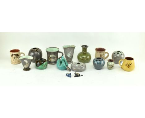 A collection of sixteen pieces of English studio pottery centrepieces. The lot comprising seven pieces of studio pottery by F