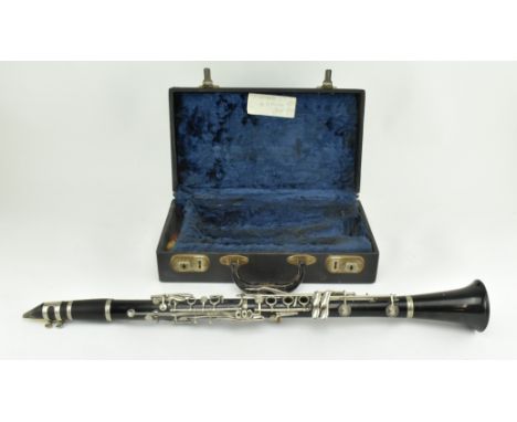 A vintage early - mid 20th century Boosey &amp; Hawkes clarinet in original faux leather case. The instrument appearing compl