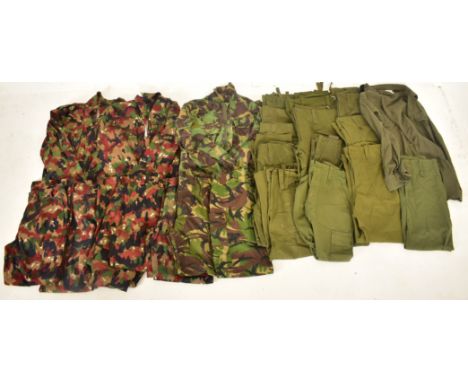 A large collection of camouflage military / hunting jackets, shirts &amp; trousers. Zipped and buttoned examples. Various siz