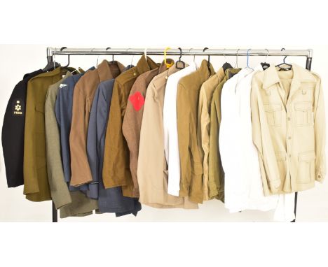 A collection of re-enactment British Military Desert / Safari and Army Officers uniform jackets / shirts. The lot to include 