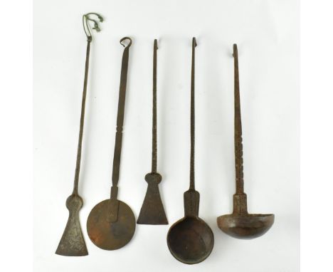 A collection of five 19th century Indian ghee utensils, comprising spoon, ladle and three shaping tools. Each instrument with