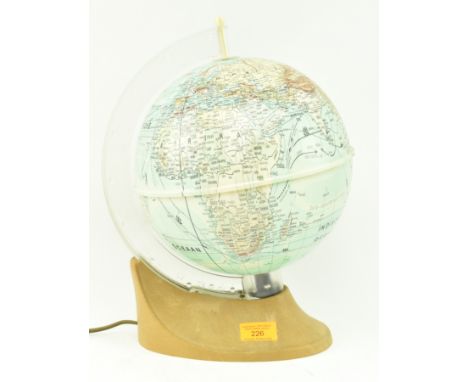 A retro 20th century West German revolving desktop terrestrial globe lamp light. The globe having a&nbsp;single arch scale ra