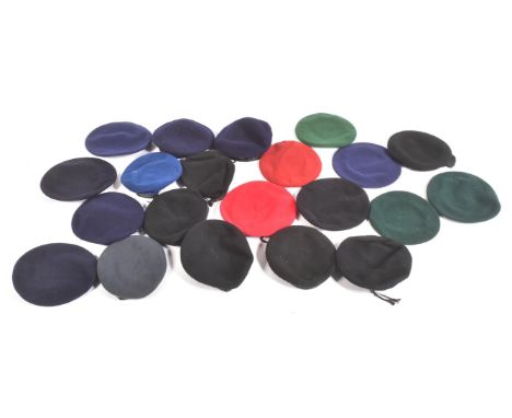 A collection of assorted unbadged military berets of various colours to include paratrooper maroon, commando green, British A
