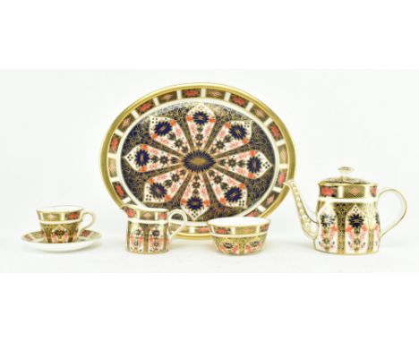 Royal Crown Derby- An Old Imari fine bone china miniature six-piece bachelor’s tea set to include a tray with lidded teapot, 