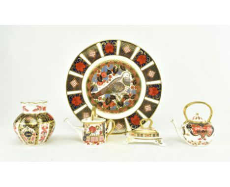 Royal Crown Derby - A collection of five fine bone china items to include a paperweight plate in the pattern &lsquo;Millenium