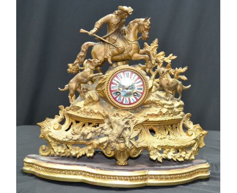 A Jappy Freres ormolu mantel clock, mounted huntsman with dogs and fox to pediment, enamelled face, Roman numerals.