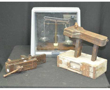 A set of scientific scales by Griffin; two wooden vices; a wooden ammunition style box. (4)