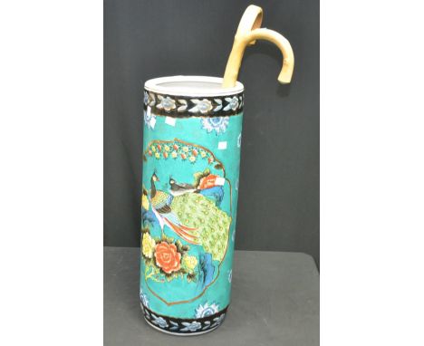 An Oriental stick stand, turquoise ground, Peacocks; two walking canes