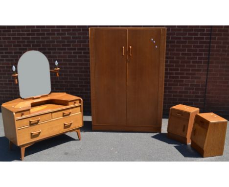An Ernst Gomme, G-Plan oak bedroom suite, comprising double wardrobe, dressing table with two light sconces, two bedside cabi