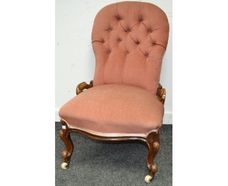 A Victorian walnut button back chair, cabriole legs