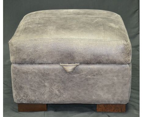 A designer leather pouffe/ottoman
