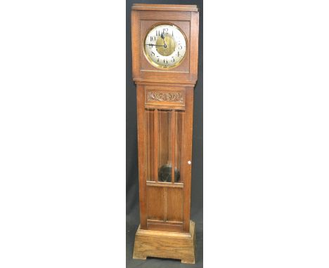 An Art Deco oak cased chiming Grandfather clock