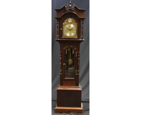 A reproduction grandmother clock, Tempus Fugit arched brass face, silvered chapter ring, Roman numerals.