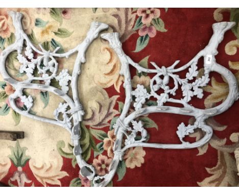 A pair of Victorian Coalbrookdale cast iron bench ends cast with oak leaves and acorns.