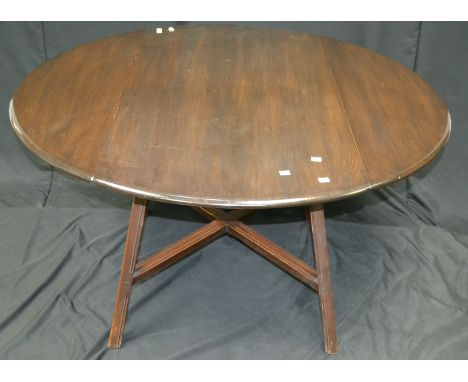 An Ercol style dropleaf dining table, oval top, spreading legs and X-frame stretchers to base. 72cm high x 113cm wide x 63cm 