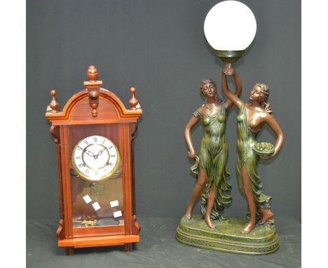 A Canterbury 31-day wall clock; a figural table lamp (2)