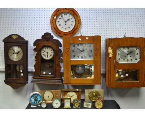 Clocks - a Morbier golden oak cased Art Deco wall clock, silvered octagonal dial, Arabic numerals, carved and applied fruitin
