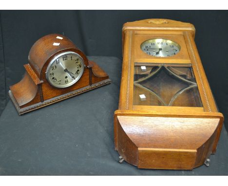 A 1940's oak mantel clock; an oak wall clock (2)
