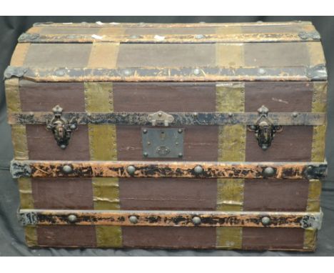 Vintage luggage - a wood bound dome top travel trunk.