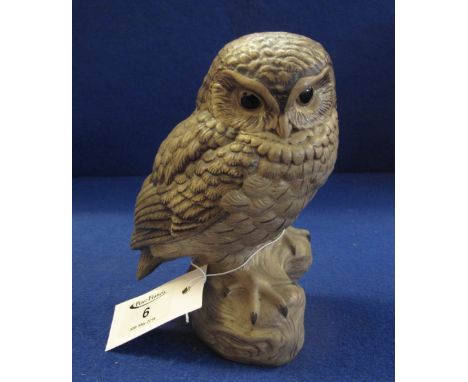 Poole pottery stoneware study of a little owl. Impressed marks with signature B. Linley Adams to the base. 14cm high approx. 