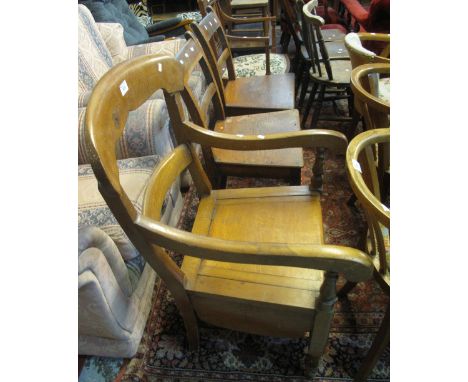 Pair of 19th Century oak bar back farmhouse kitchen chairs together with a 19th Century oak bar back open armchair commode. (