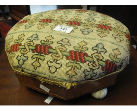 Victorian octagonal upholstered footstool on fluted ceramic knob feet.(B.P. 24% incl. VAT)