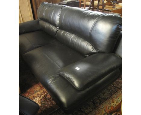 Large modern black leather two seater sofa on a chrome base.(B.P. 24% incl. VAT)