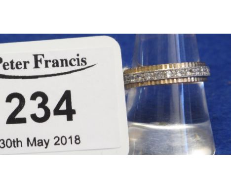 9ct gold and spinel eternity ring.(B.P. 24% incl. VAT)