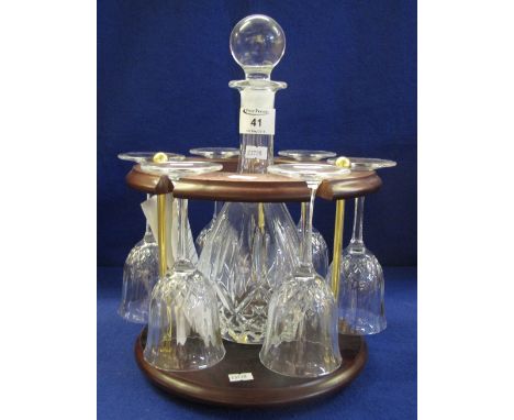 Modern Capri crystal decanter and wine glass set on mahogany finish stand.(B.P. 24% incl. VAT) 