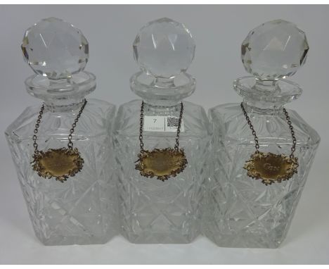 Set of three crystal decanters with hallmarked silver bottle labels, Gin, Whisky and Brandy    Condition Report   Click here 