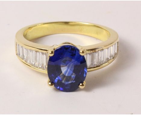 18ct gold ring set with an oval sapphire and diamond baguettes (sapphire 2.75 carat, tested to 18k)   Condition Report   Clic