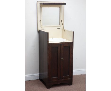 Early 20th century oak cased possibly military campaign washstand, hinged lid reveals ceramic sink and mirror, cupboard below