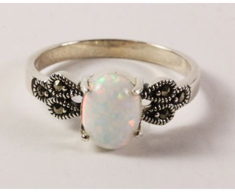 Opal and marcasite ring stamped 925   Condition Report   Click here for further images, condition, auction times & delivery c