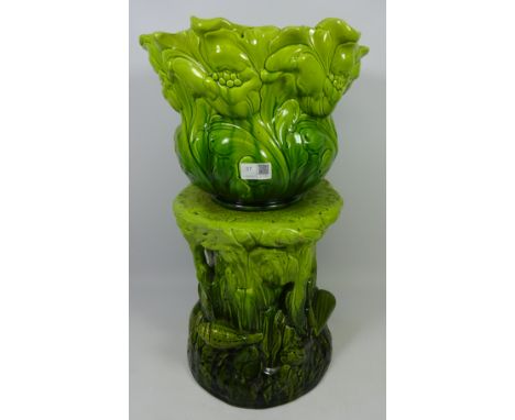 Early 20th Century Bretby jardiniere, the base in naturalistic form moulded with shells and planter moulded with flowers    C