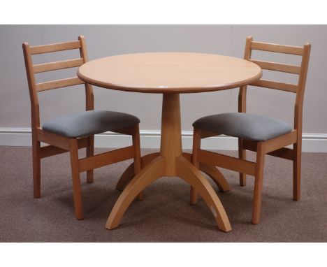 Light wood circular dining table and two chairs   Condition Report   Click here for further images, condition, auction times 