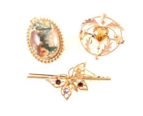 Three vintage gold brooches, an oval moss agate 25mm x 17mm in a 9 carat yellow gold rope edge frame, pendant loop to top, a 